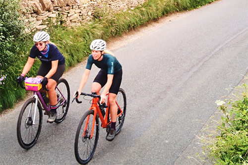 Two people cycling